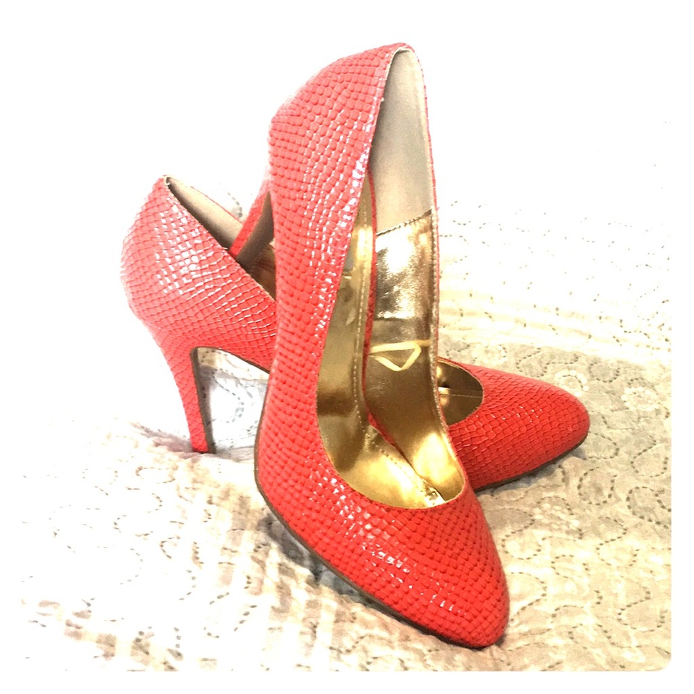 Red snakeskin like heels.